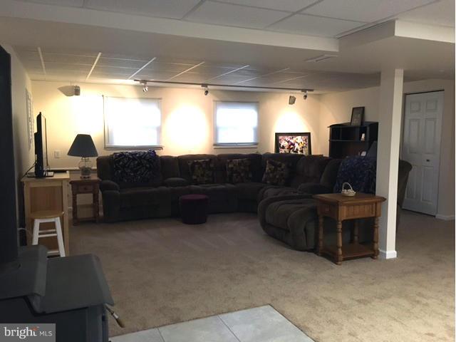 8107 Hog Neck Road Pasadena, MD 21122 - Photo 22 of 27 a living room with furniture and a window
