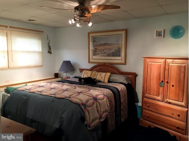 8107 Hog Neck Road Pasadena, MD 21122 - Photo 23 of 27 a bedroom with bed and window