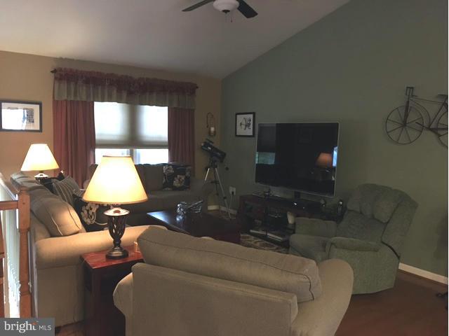8107 Hog Neck Road Pasadena, MD 21122 - Photo 10 of 27 a living room with furniture and a flat screen tv