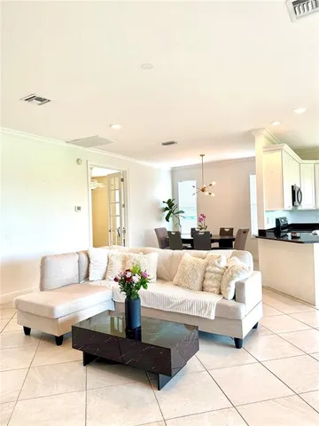 a view of a livingroom with furniture and entryway