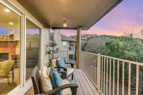 a view of a balcony with furniture