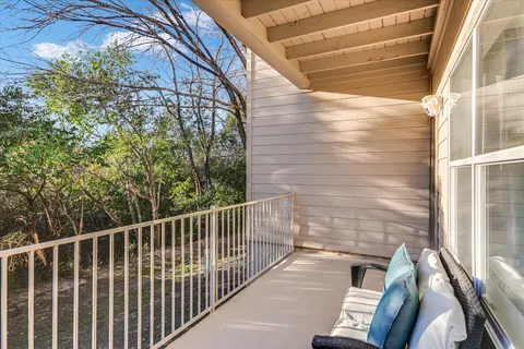 a view of a balcony with a potted plant