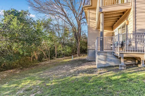 a backyard of a house with outdoor seating