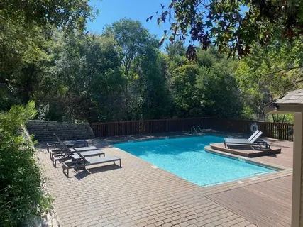 a view of a backyard with a patio