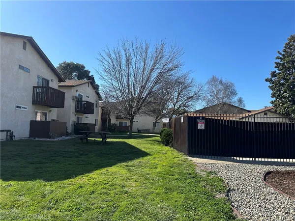 a view of a backyard of the house