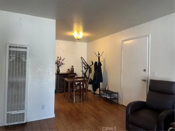 a view of a livingroom with furniture and wooden floor