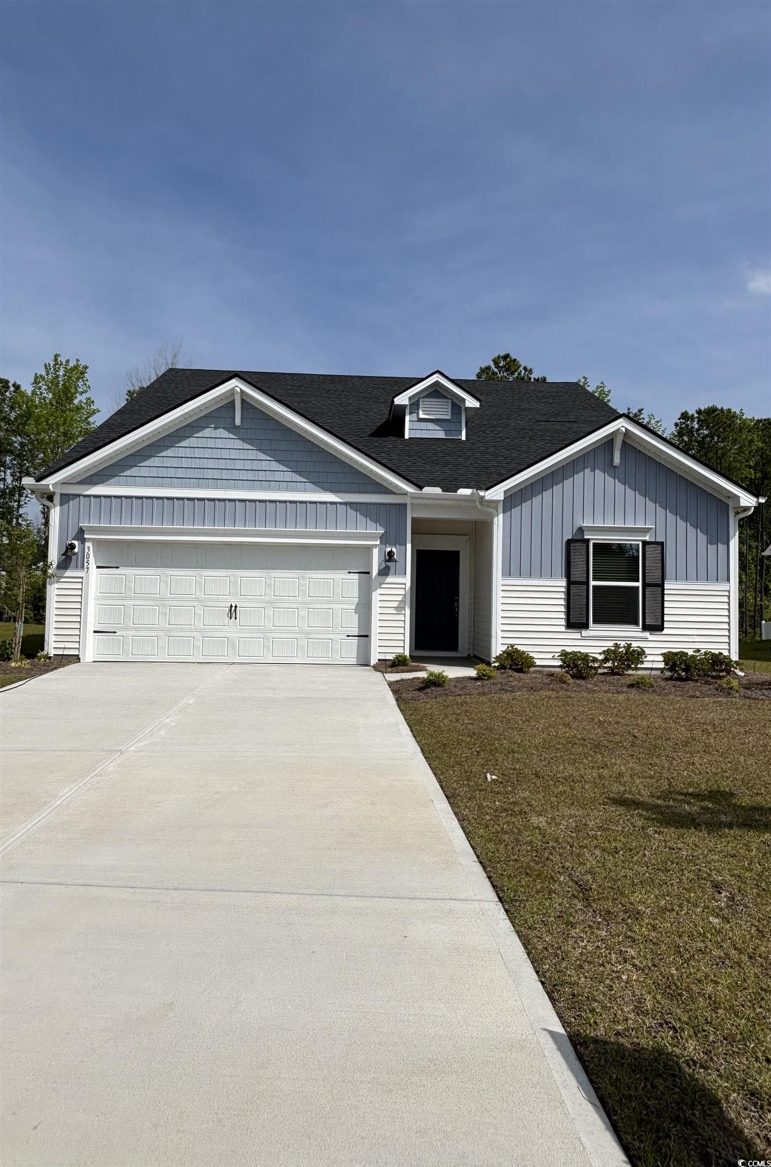 2035 Copper Crk Loop Longs, SC 29568 - Photo 1 of 18 View of front of house featuring driveway, an atta