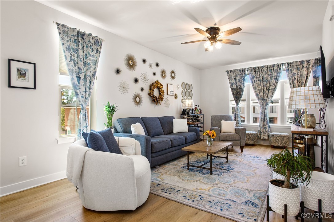 1321 Ewing Pk Loop Midlothian, VA 23113 - Photo 11 of 30 a living room with furniture and a large window with wooden floor