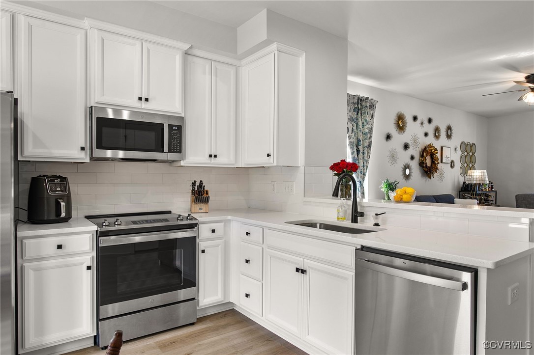 1321 Ewing Pk Loop Midlothian, VA 23113 - Photo 16 of 30 a kitchen with white cabinets and white appliances