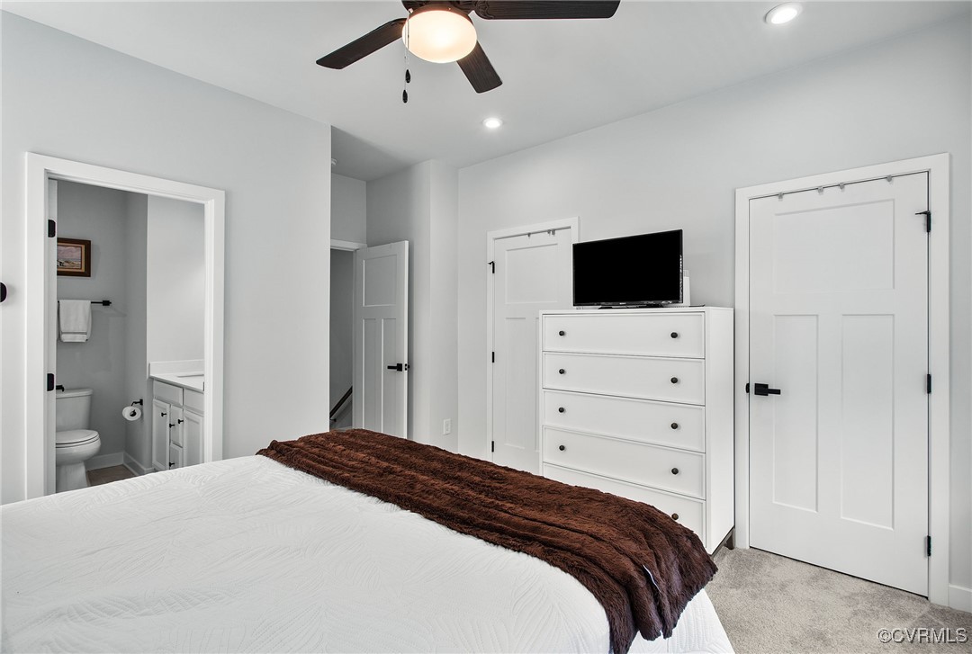 1321 Ewing Pk Loop Midlothian, VA 23113 - Photo 23 of 30 a bedroom with a large bed and a flat tv screen on dresser