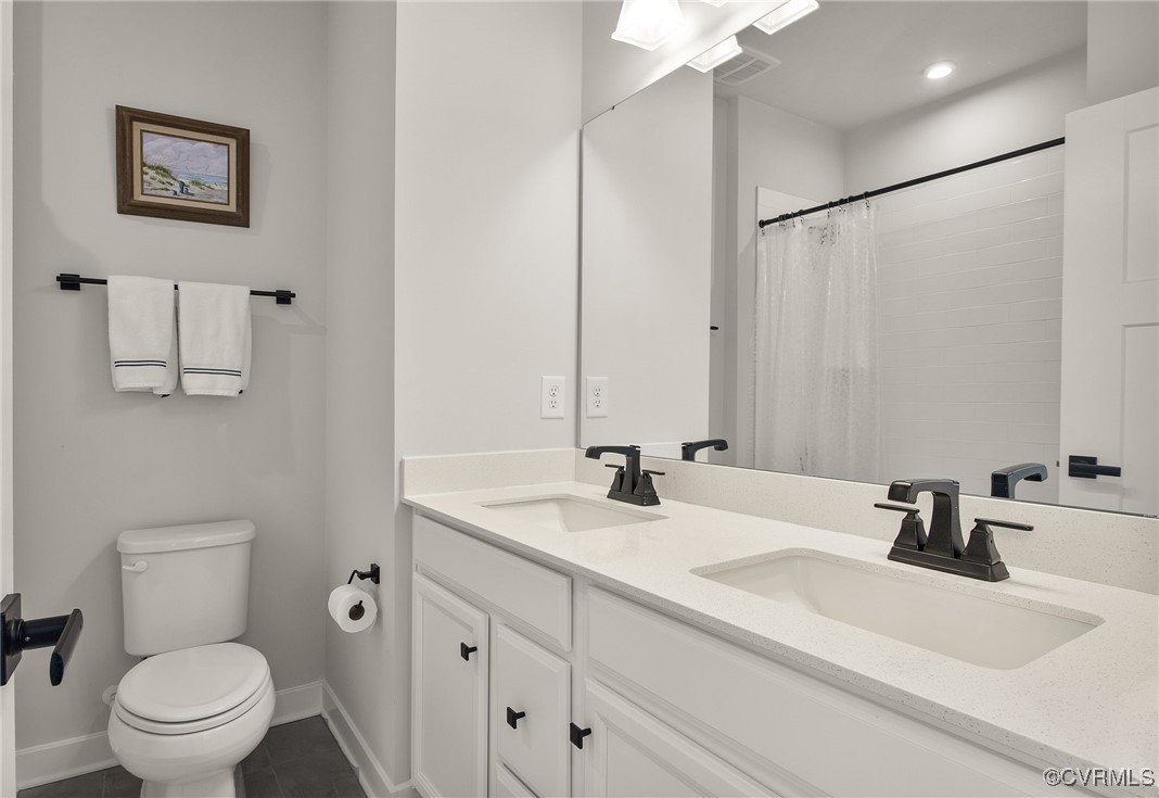 1321 Ewing Pk Loop Midlothian, VA 23113 - Photo 24 of 30 a bathroom with a sink toilet and shower