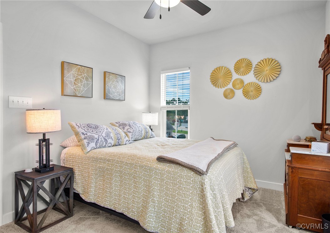 1321 Ewing Pk Loop Midlothian, VA 23113 - Photo 27 of 30 a bedroom with a bed and a lamp