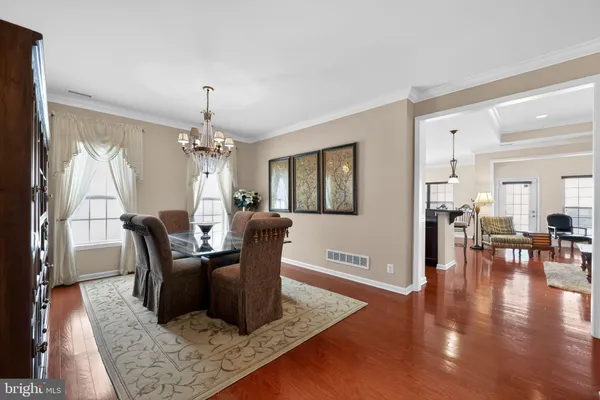 a living room with furniture rug and window