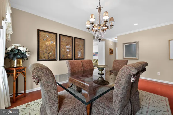 a living room with furniture a chandelier and a chandelier