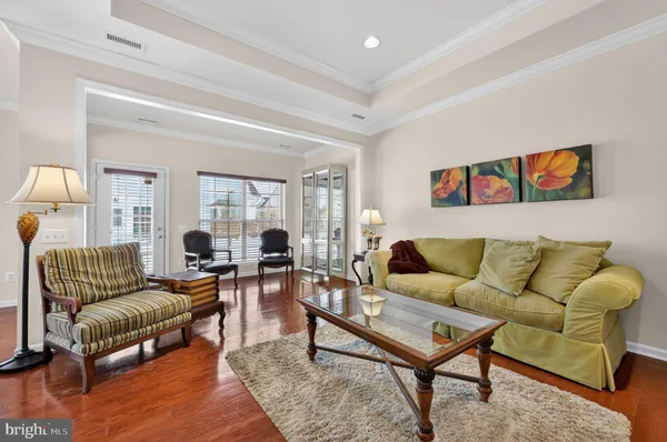 a living room with furniture and a rug