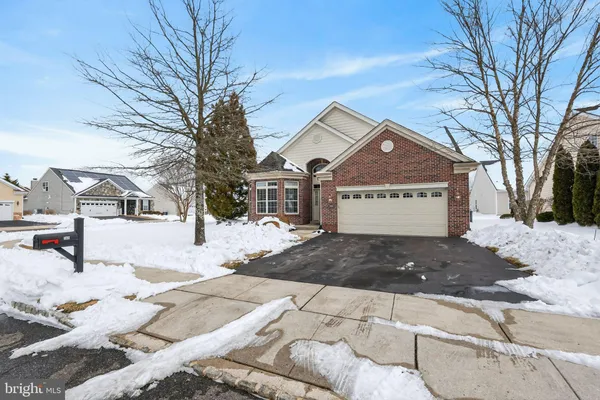a view of a parking space in front of a house