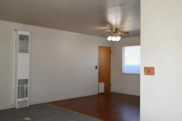 a view of a livingroom with a chandelier fan