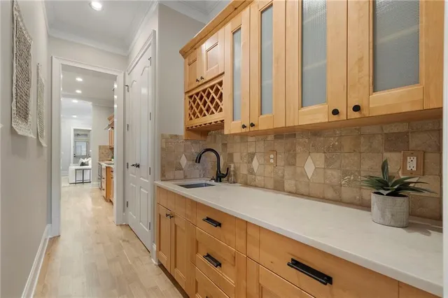 a dining room with furniture window entryway and wooden floor