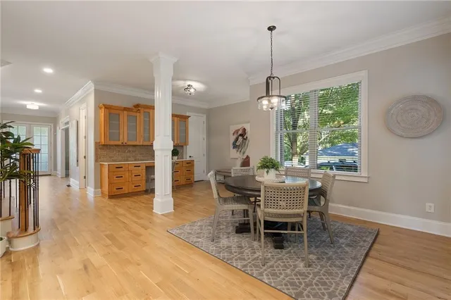 a bathroom with a granite countertop sink a toilet and shower