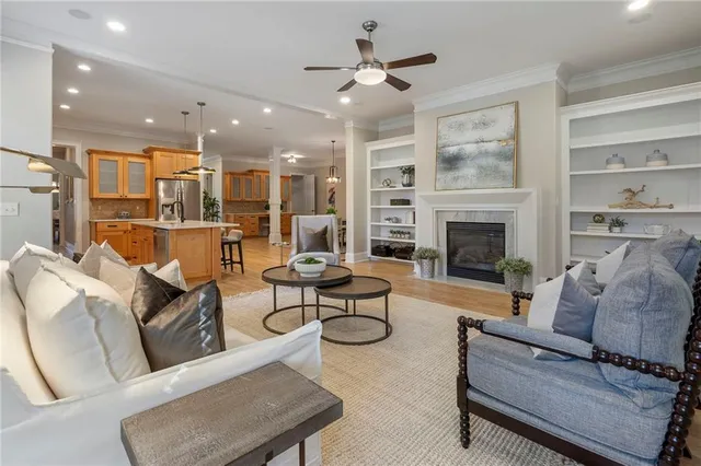 a spacious bedroom with bed and a chandelier