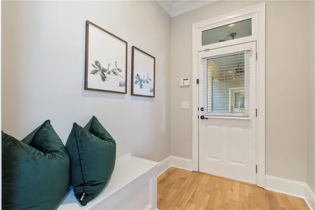 a bathroom with a granite countertop sink a toilet a mirror a bathtub and shower