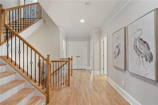 a kitchen with stainless steel appliances granite countertop a sink stove microwave and refrigerator