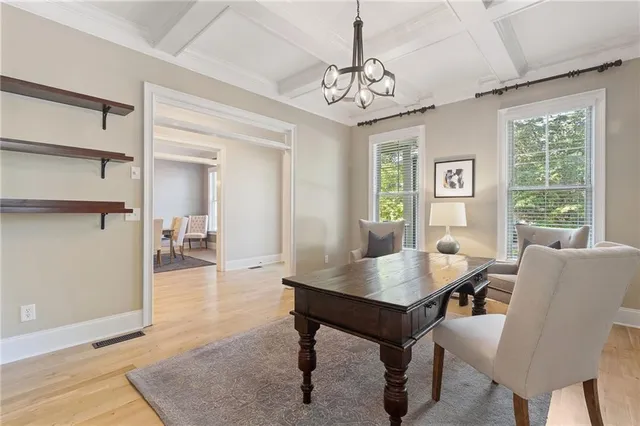 a spacious bathroom with a sink and a mirror
