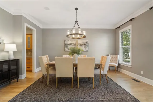 a kitchen with sink stove and cabinets