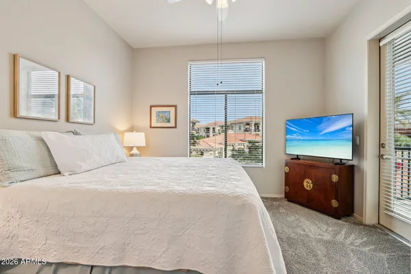 a bedroom with a bed and a fireplace
