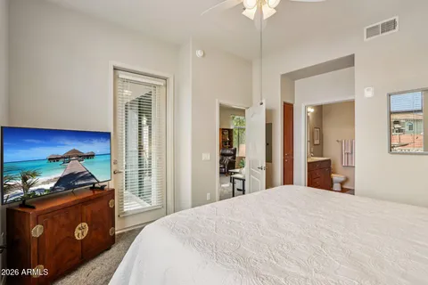 a bed room with a bed and a chandelier