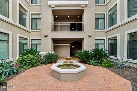 a front view of a house with a yard garage and outdoor seating