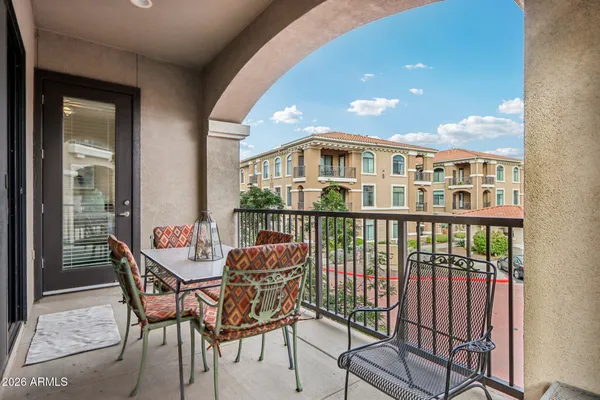 a view of a balcony with furniture