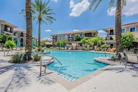 a swimming pool with outdoor seating and yard