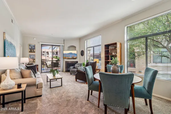 a living room with furniture and a large window
