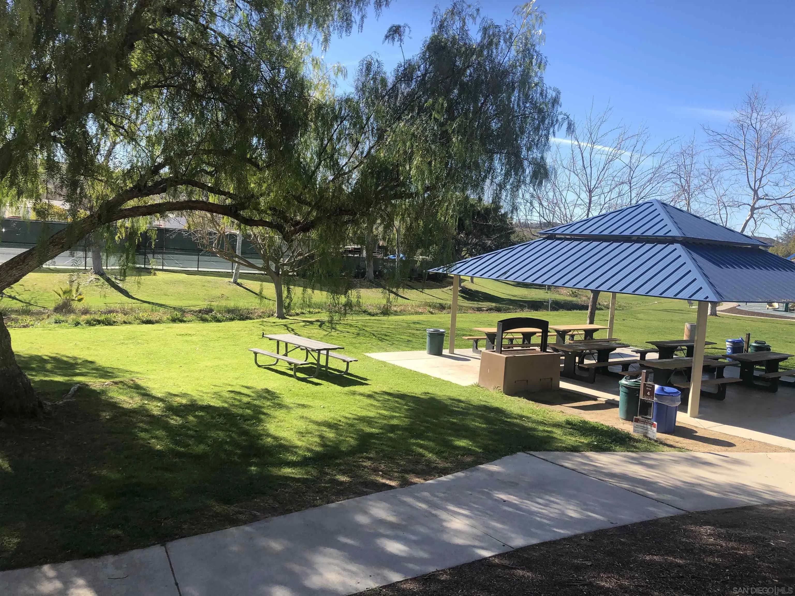 13075 Olympus Circle, Unit 1 Poway, CA 92064 - Photo 15 of 16 a view of swimming pool with lawn chairs under an umbrella