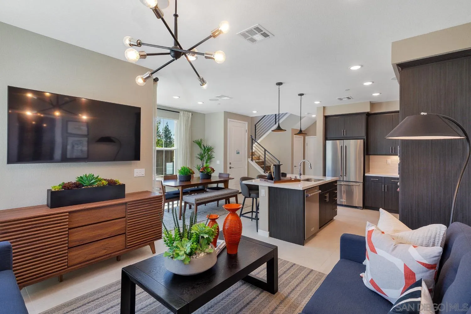 13075 Olympus Circle, Unit 1 Poway, CA 92064 - Photo 3 of 16 a living room with furniture kitchen view and a wooden floor