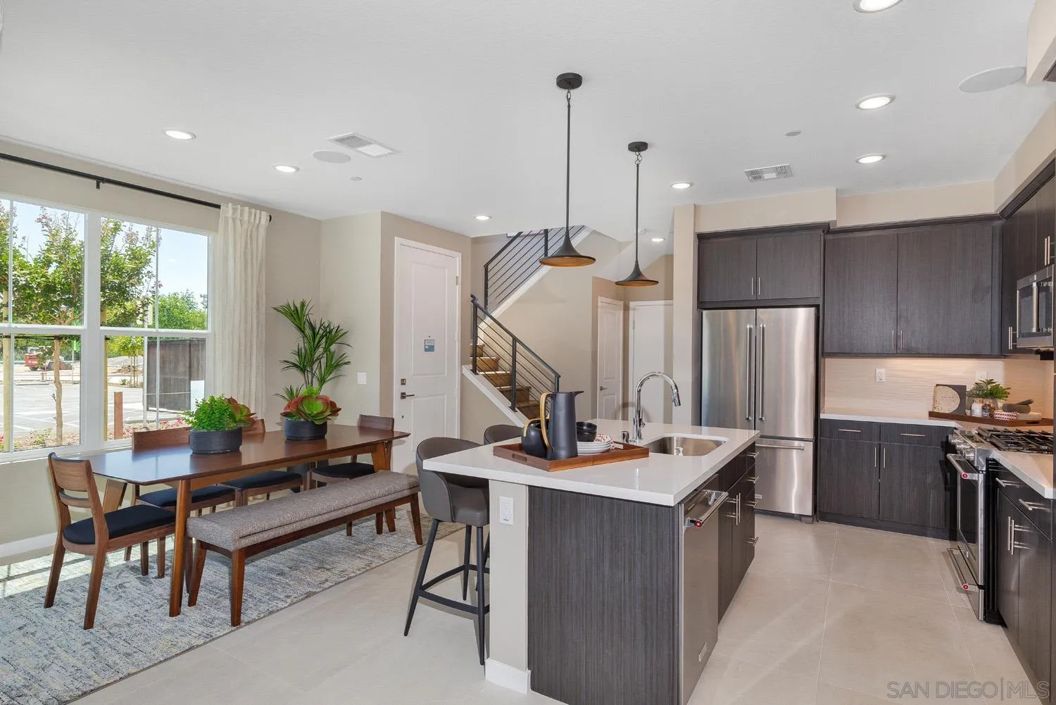 13075 Olympus Circle, Unit 1 Poway, CA 92064 - Photo 5 of 16 a room with furniture a bed and a chandelier