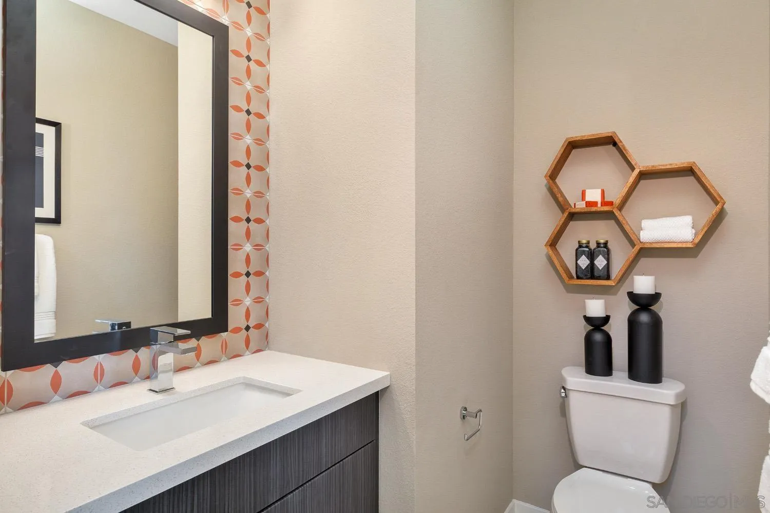 13075 Olympus Circle, Unit 1 Poway, CA 92064 - Photo 8 of 16 a bathroom with a toilet sink and mirror