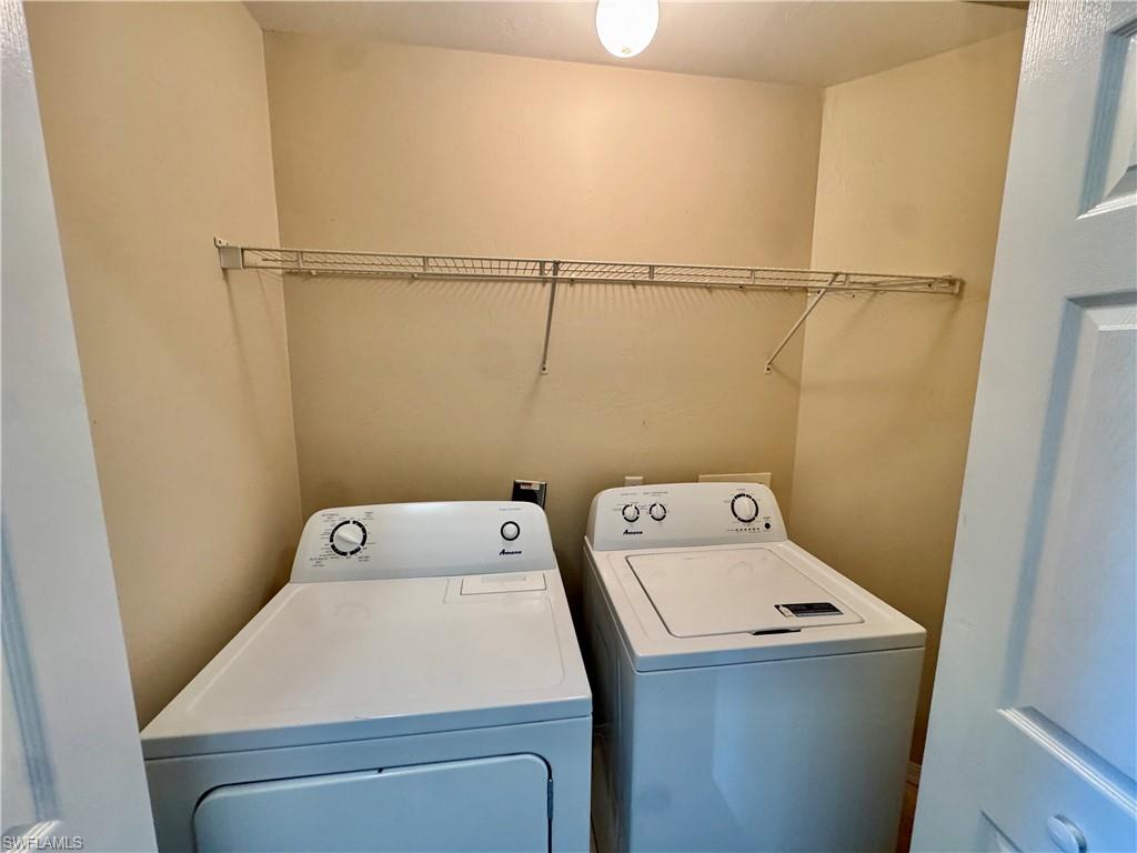 912 Hampton Circle, Unit 92 Naples, FL 34105 - Photo 15 of 31 Laundry area with washing machine and clothes dryer
