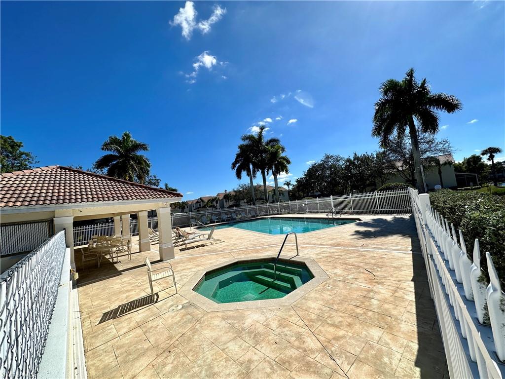 912 Hampton Circle, Unit 92 Naples, FL 34105 - Photo 26 of 31 Community pool with a patio and a community hot tub