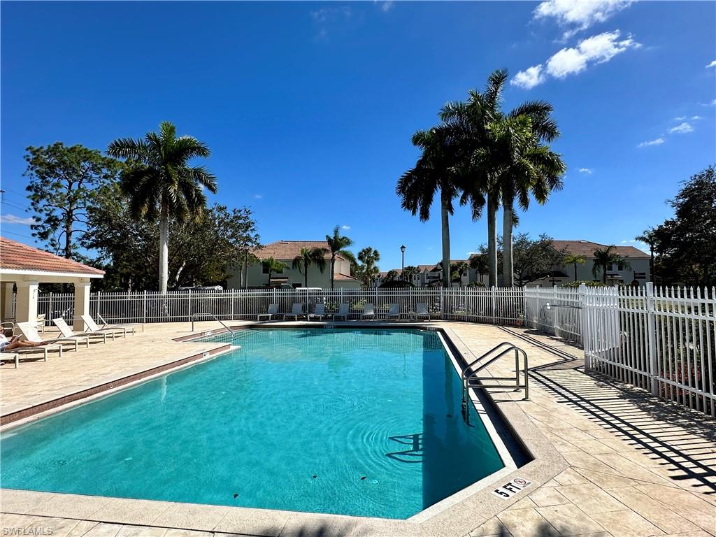 912 Hampton Circle, Unit 92 Naples, FL 34105 - Photo 28 of 30 a view of a swimming pool with a patio