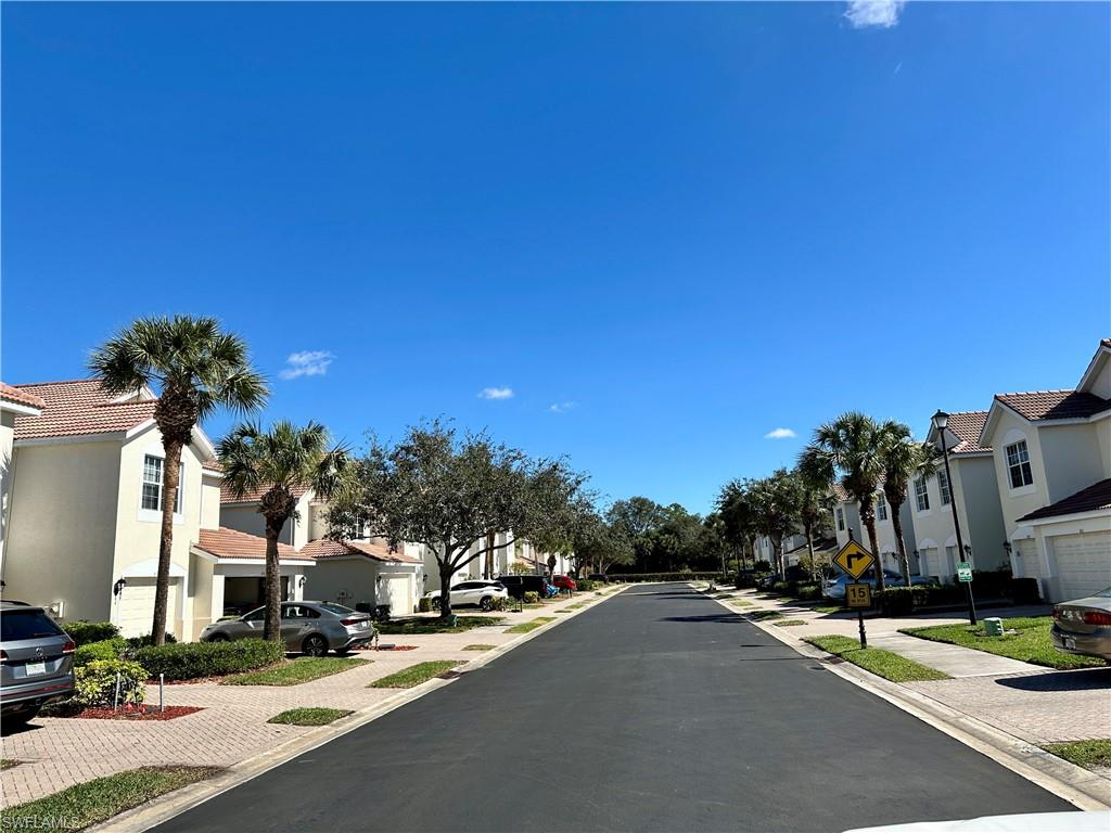 912 Hampton Circle, Unit 92 Naples, FL 34105 - Photo 29 of 30 a view of a street with houses on both side