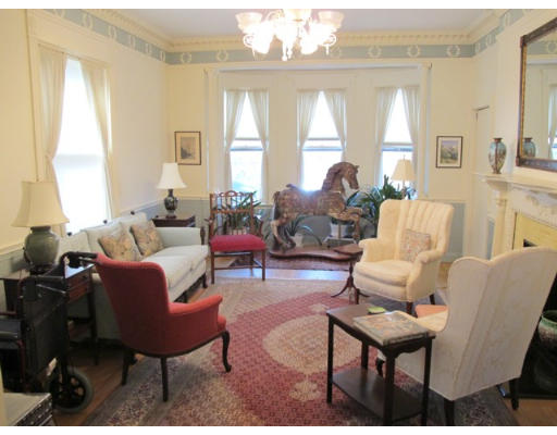 67 Buckminster Road Brookline, MA 02445 - Photo 3 of 11 a living room with furniture and a large window