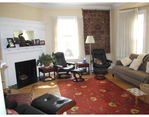 67 Buckminster Road Brookline, MA 02445 - Photo 4 of 11 a living room with furniture and a fireplace