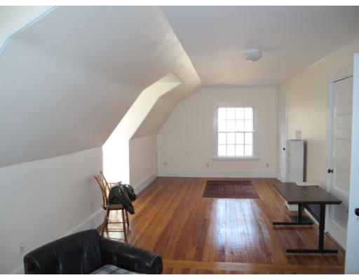 67 Buckminster Road Brookline, MA 02445 - Photo 9 of 11 a view of a livingroom with wooden floor and furniture
