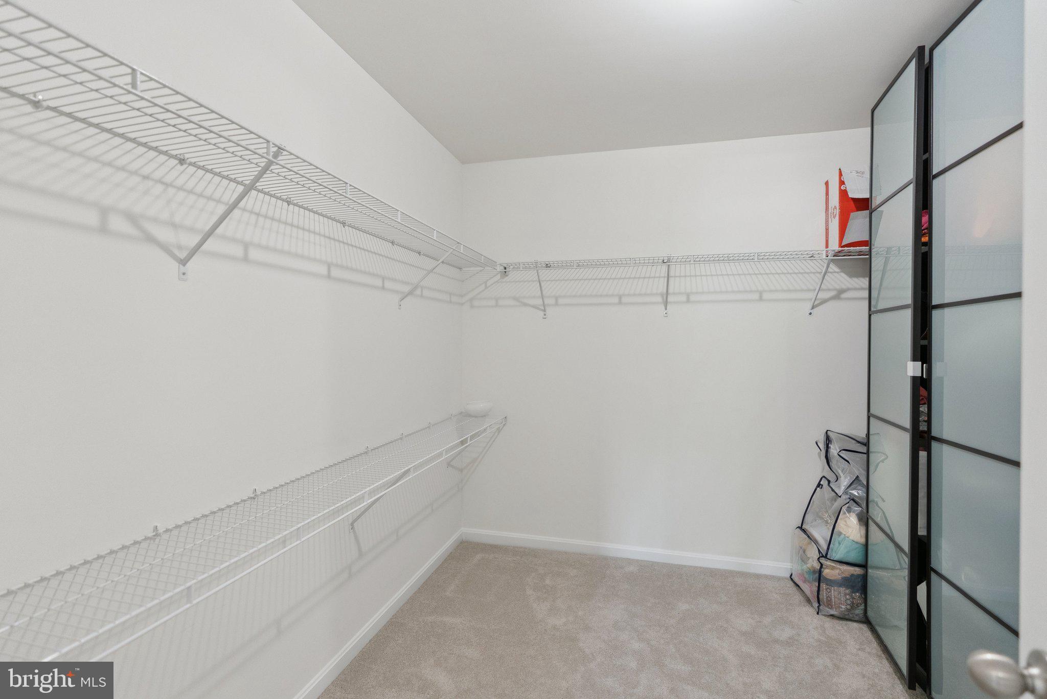 5402 Loggerhead Place Woodbridge, VA 22193 - Photo 18 of 40 a view of a room with racks on the wall