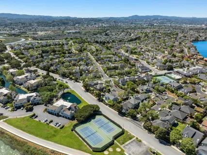 an aerial view of residential houses with outdoor space