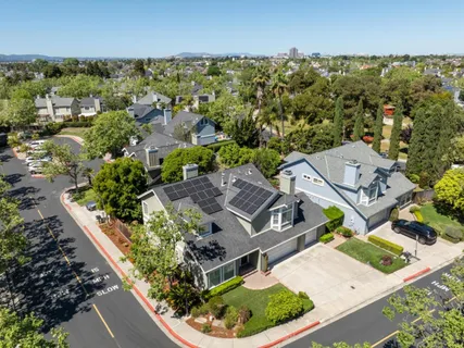 an aerial view of a house with a garden
