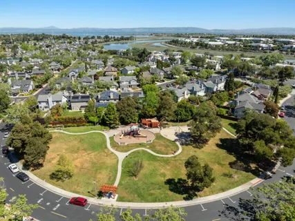 an aerial view of a residential houses with outdoor space