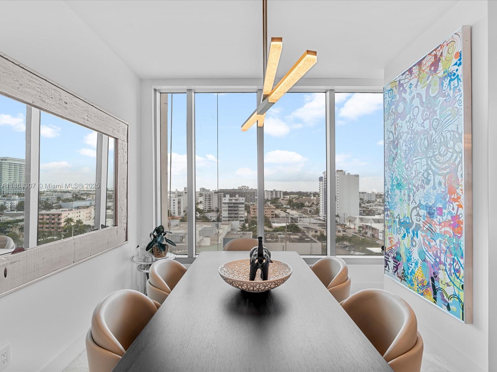 6899 Collins Avenue, Unit 1010 Miami Beach, FL 33141 - Photo 12 of 37 a living room with furniture and a large window